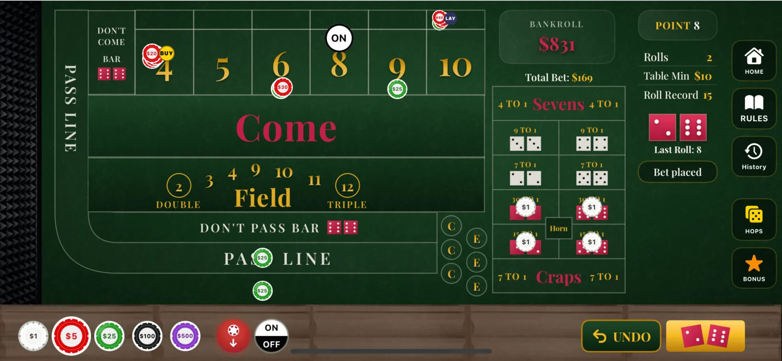 The Press It! Craps table mid-hand, with the point on 8, chips on the pass line, a place 6, a buy 4 and a lay bet working.